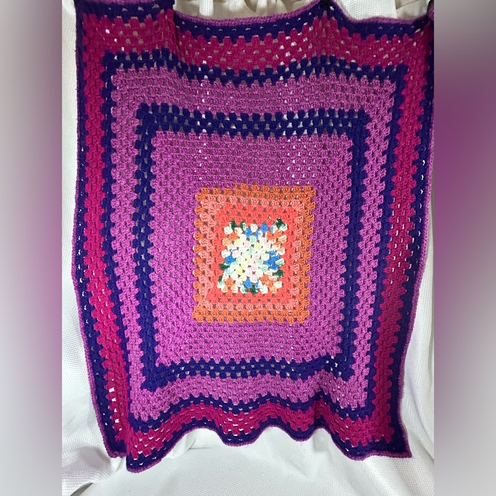 Homemade square crochet, blanket, purple colors
